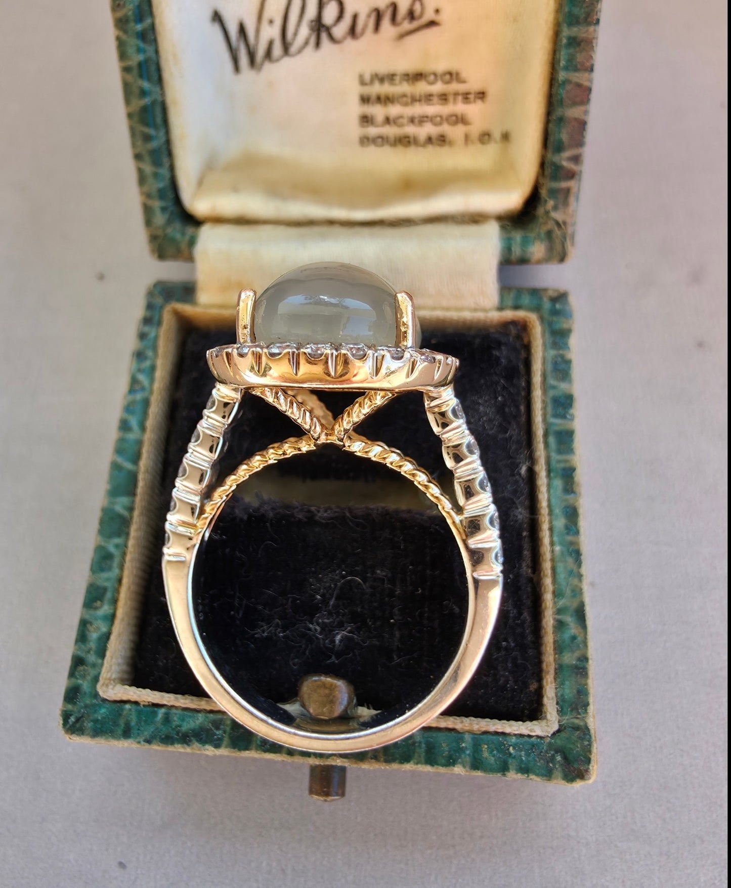 8ct Moonstone and Diamond Halo ring