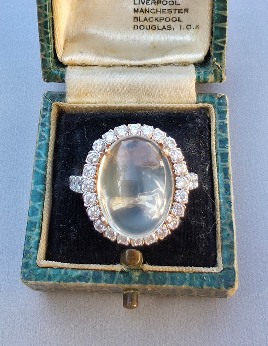 8ct Moonstone and Diamond Halo ring