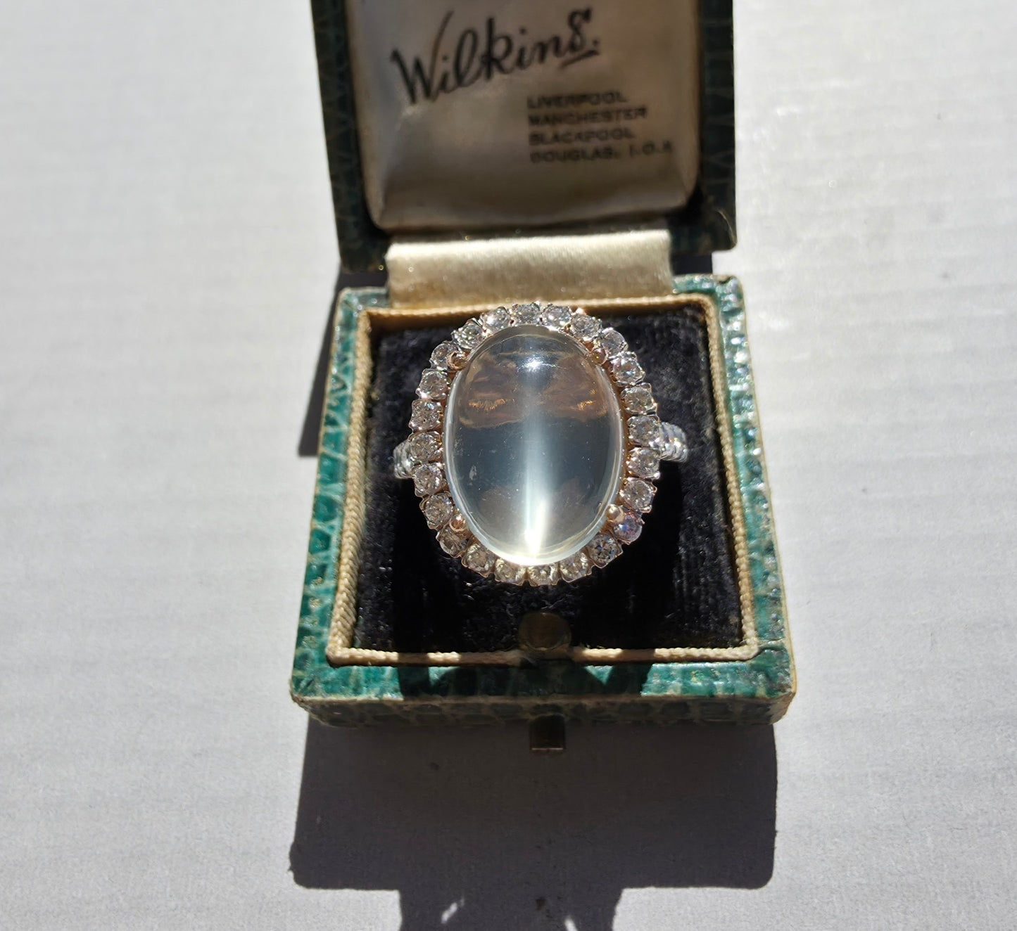 8ct Moonstone and Diamond Halo ring